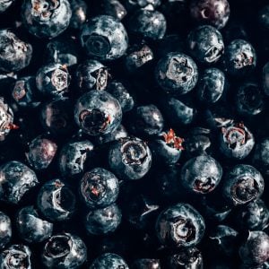 Close up image of fresh blueberries with strong sunlight, summer concept, background image from above, food flatlay